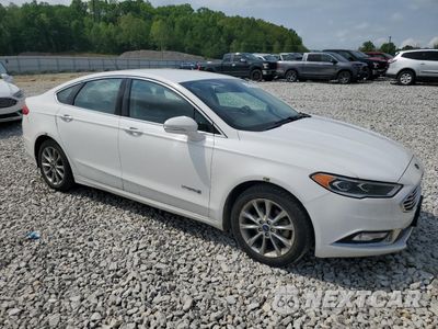 Czwarte zdjęcie samochodu z boku: 2017 FORD FUSION SE HYBRID VIN:3FA6P0LU2HR400731 - miniatura