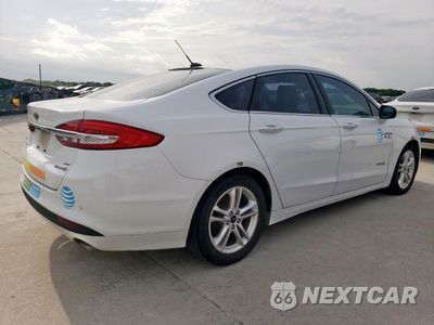 Trzecie zdjęcie samochodu z tyłu: 2018 FORD FUSION SE HYBRID VIN:3FA6P0LU6JR171668 - miniatura