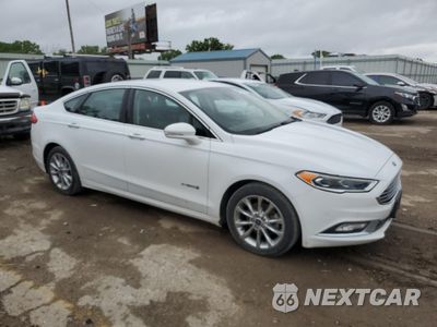Czwarte zdjęcie samochodu z boku: 2017 FORD FUSION SE HYBRID VIN:3FA6P0LU7HR409098 - miniatura