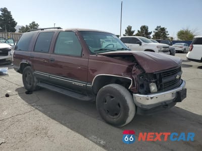Czwarte zdjęcie samochodu z boku: 1999 CHEVROLET TAHOE K1500 VIN:1GNEK13R7XR129141 - miniatura