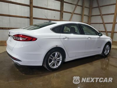 Trzecie zdjęcie samochodu z tyłu: 2018 FORD FUSION SE HYBRID VIN:3FA6P0LU0JR172010 - miniatura