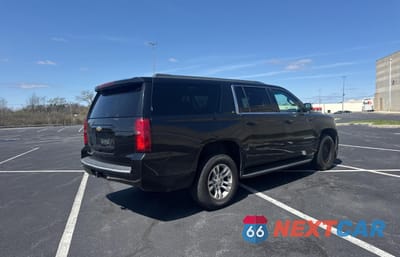 Czwarte zdjęcie samochodu z boku: 2015 CHEVROLET SUBURBAN K1500 LT VIN:1GNSKJKCXFR193284 - miniatura