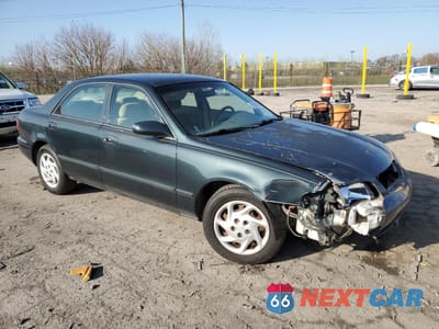 Czwarte zdjęcie samochodu z boku: 2002 MAZDA 626 LX VIN:1YVGF22C625265716 - miniatura