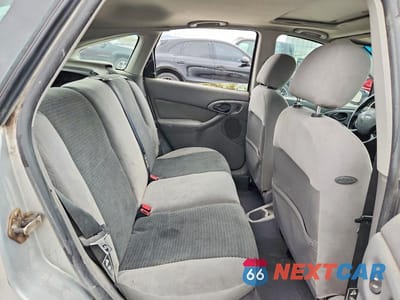 Zdjęcie 10 z 12 samochodu: 2002 FORD FOCUS ZX5 VIN:3FAHP373X2R192018 - miniatura
