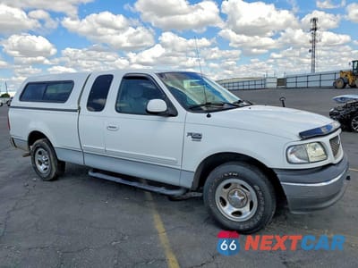 Czwarte zdjęcie samochodu z boku: 2002 FORD F150 VIN:1FTRX17L82NB30364 - miniatura