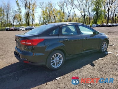 Trzecie zdjęcie samochodu z tyłu: 2017 FORD FOCUS SE VIN:1FADP3F29HL269167 - miniatura