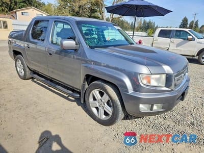 Czwarte zdjęcie samochodu z boku: 2009 HONDA RIDGELINE RTL VIN:5FPYK16519B100877 - miniatura