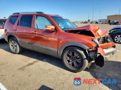 Czwarte zdjęcie samochodu z boku: 2009 KIA BORREGO LX VIN:KNDJJ741595037154 - miniatura