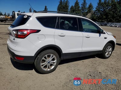 Trzecie zdjęcie samochodu z tyłu: 2018 FORD ESCAPE SE VIN:1FMCU9GD7JUD37835 - miniatura