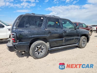 Trzecie zdjęcie samochodu z tyłu: 2003 GMC YUKON DENALI VIN:1GKEK63U83J327489 - miniatura