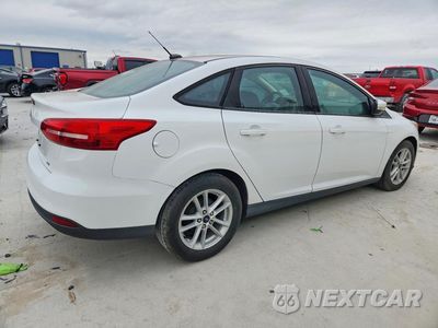 Trzecie zdjęcie samochodu z tyłu: 2017 FORD FOCUS SE VIN:1FADP3F28HL315734 - miniatura