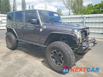 Czwarte zdjęcie samochodu z boku: 2016 JEEP WRANGLER UNLIMITED RUBICON VIN:1C4BJWFG4GL251951 - miniatura