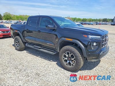 Czwarte zdjęcie samochodu z boku: 2025 GMC CANYON AT4 VIN:1GTP2DEK6S1240001 - miniatura