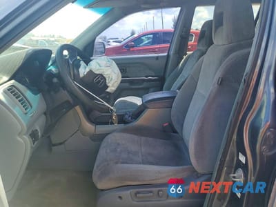 Zdjęcie 7 z 12 samochodu: 2004 HONDA PILOT EX VIN:2HKYF184X4H580400 - miniatura