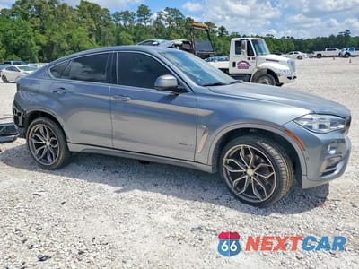 Czwarte zdjęcie samochodu z boku: 2019 BMW X6 SDRIVE35I VIN:5UXKU0C53K0S97822 - miniatura
