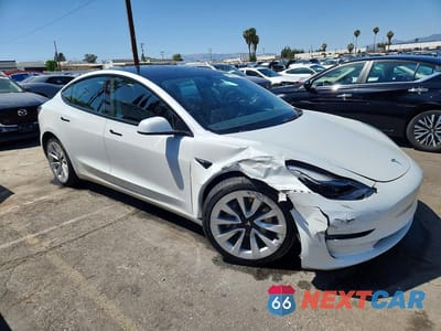 Czwarte zdjęcie samochodu z boku: 2023 TESLA MODEL 3 VIN:5YJ3E1EA2PF450377 - miniatura