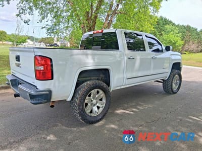 Czwarte zdjęcie samochodu z boku: 2015 GMC SIERRA K1500 SLT VIN:3GTU2VEC4FG299704 - miniatura