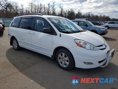 Czwarte zdjęcie samochodu z boku: 2010 TOYOTA SIENNA LE 7-PASSENGER VIN:5TDKK4CC0AS327108 - miniatura