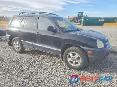 Czwarte zdjęcie samochodu z boku: 2002 HYUNDAI SANTA FE GLS VIN:KM8SC73D12U149225 - miniatura