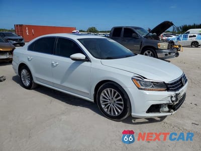 Czwarte zdjęcie samochodu z boku: 2016 VOLKSWAGEN PASSAT SE VIN:1VWBT7A3XGC048970 - miniatura