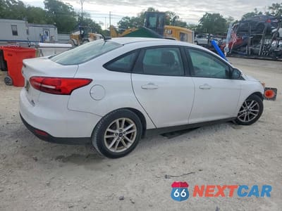 Trzecie zdjęcie samochodu z tyłu: 2016 FORD FOCUS SE VIN:1FADP3F25GL401484 - miniatura