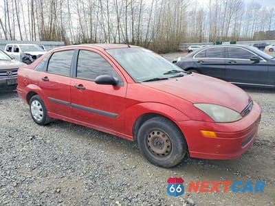 Czwarte zdjęcie samochodu z boku: 2004 FORD FOCUS LX VIN:1FAFP33P14W132192 - miniatura