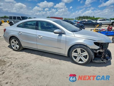 Czwarte zdjęcie samochodu z boku: 2014 VOLKSWAGEN CC SPORT VIN:WVWBN7AN8EE540817 - miniatura
