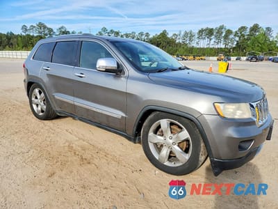 Czwarte zdjęcie samochodu z boku: 2013 JEEP GRAND CHEROKEE OVERLAND VIN:1C4RJFCT1DC531984 - miniatura
