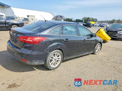 Trzecie zdjęcie samochodu z tyłu: 2015 FORD FOCUS SE VIN:1FADP3F21FL213723 - miniatura