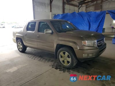Czwarte zdjęcie samochodu z boku: 2009 HONDA RIDGELINE RTL VIN:2HJYK16519H502767 - miniatura
