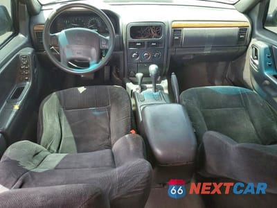 Zdjęcie 8 z 13 samochodu: 1999 JEEP GRAND CHEROKEE LAREDO VIN:1J4GW58S1XC564663 - miniatura