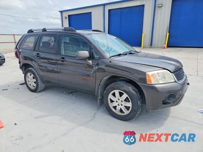 Czwarte zdjęcie samochodu z boku: 2011 MITSUBISHI ENDEAVOR LS VIN:4A4JM2AS0BE033910 - miniatura