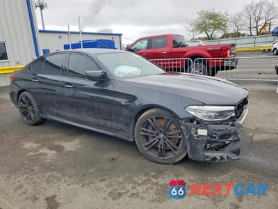 Czwarte zdjęcie samochodu z boku: 2018 BMW M5 VIN:WBSJF0C50JB283038 - miniatura