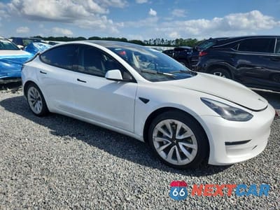 Czwarte zdjęcie samochodu z boku: 2023 TESLA MODEL 3 VIN:5YJ3E1EA5PF563773 - miniatura
