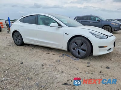 Czwarte zdjęcie samochodu z boku: 2020 TESLA MODEL 3 VIN:5YJ3E1EB8LF639621 - miniatura