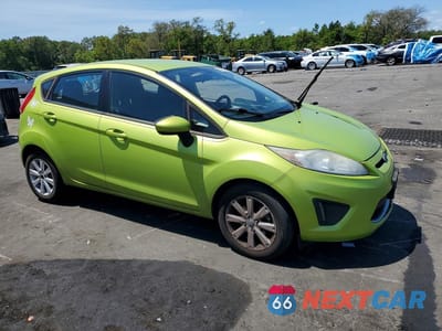 Czwarte zdjęcie samochodu z boku: 2011 FORD FIESTA SE VIN:3FADP4EJ8BM196040 - miniatura