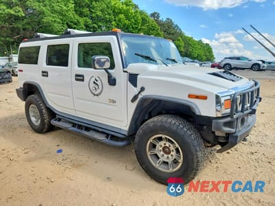 Czwarte zdjęcie samochodu z boku: 2003 HUMMER H2 VIN:5GRGN23U43H130412 - miniatura