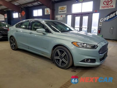 Czwarte zdjęcie samochodu z boku: 2013 FORD FUSION SE HYBRID VIN:3FA6P0LU6DR146127 - miniatura