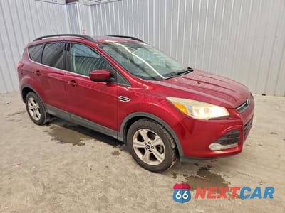 Czwarte zdjęcie samochodu z boku: 2014 FORD ESCAPE SE VIN:1FMCU0GX0EUB38542 - miniatura