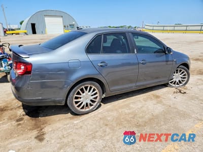 Trzecie zdjęcie samochodu z tyłu: 2009 VOLKSWAGEN JETTA WOLFSBURG VIN:3VWRJ71K89M076733 - miniatura