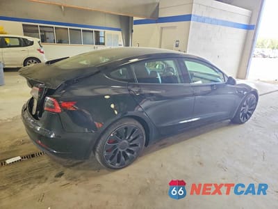 Trzecie zdjęcie samochodu z tyłu: 2023 TESLA MODEL 3 VIN:5YJ3E1EC2PF468332 - miniatura