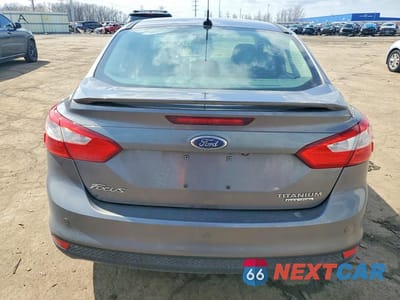 Zdjęcie 6 z 11 samochodu: 2014 FORD FOCUS TITANIUM VIN:1FADP3J21EL116950 - miniatura