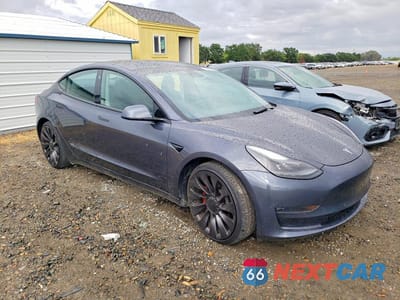 Czwarte zdjęcie samochodu z boku: 2022 TESLA MODEL 3 VIN:5YJ3E1EC3NF156579 - miniatura
