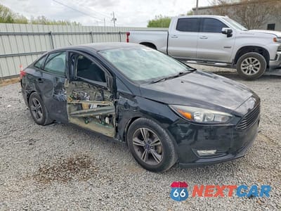 Czwarte zdjęcie samochodu z boku: 2018 FORD FOCUS SE VIN:1FADP3FE7JL226883 - miniatura