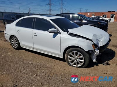 Czwarte zdjęcie samochodu z boku: 2017 VOLKSWAGEN JETTA SE VIN:3VWDB7AJ7HM312107 - miniatura