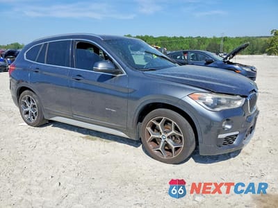 Czwarte zdjęcie samochodu z boku: 2016 BMW X1 XDRIVE28I VIN:WBXHT3C33G5E55882 - miniatura
