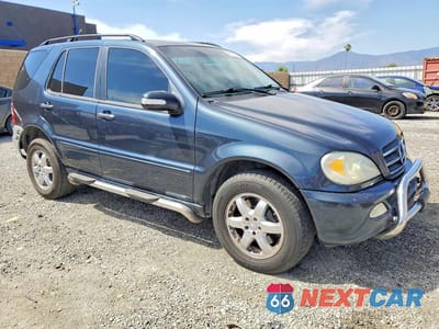 Czwarte zdjęcie samochodu z boku: 2002 MERCEDES-BENZ ML 500 VIN:4JGAB75E92A323547 - miniatura