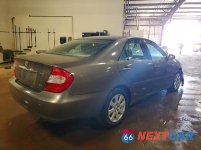 Trzecie zdjęcie samochodu z tyłu: 2003 TOYOTA CAMRY LE V6 VIN:4T1BF32K13U552171 - miniatura