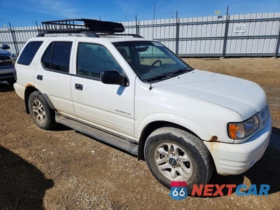 Czwarte zdjęcie samochodu z boku: 2002 ISUZU RODEO S VIN:4S2DM58W824700666 - miniatura