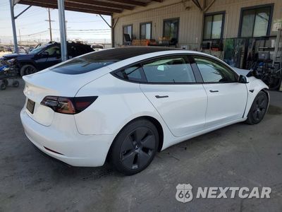 Trzecie zdjęcie samochodu z tyłu: 2022 TESLA MODEL 3 VIN:5YJ3E1EAXNF376784 - miniatura